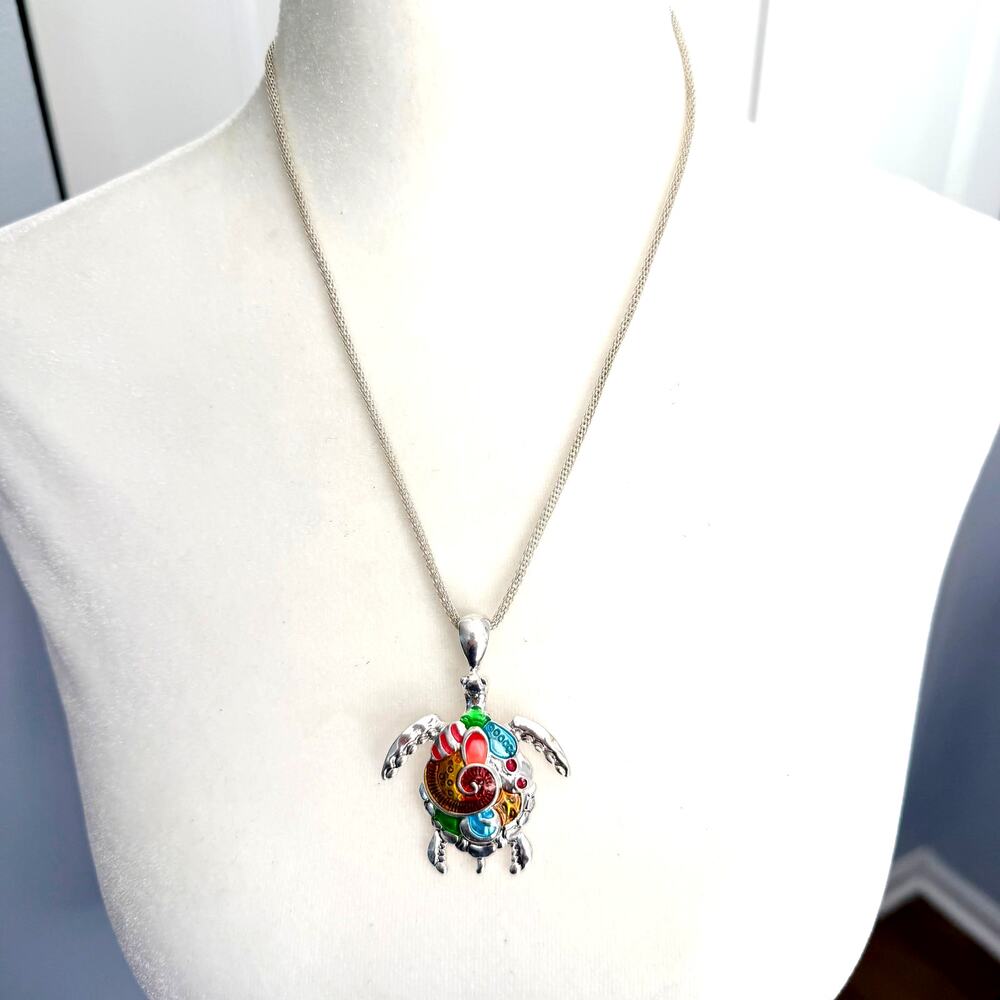 Multicolor sea turtle pendant necklace on a silver tone chain
